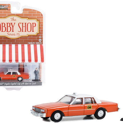 1981 Chevrolet Impala "Capitol Cab" Taxi Orange with White Top and Man in Suit Figure "The Hobby Shop" Series 15 1/64 Diecast Model Car by Greenlight